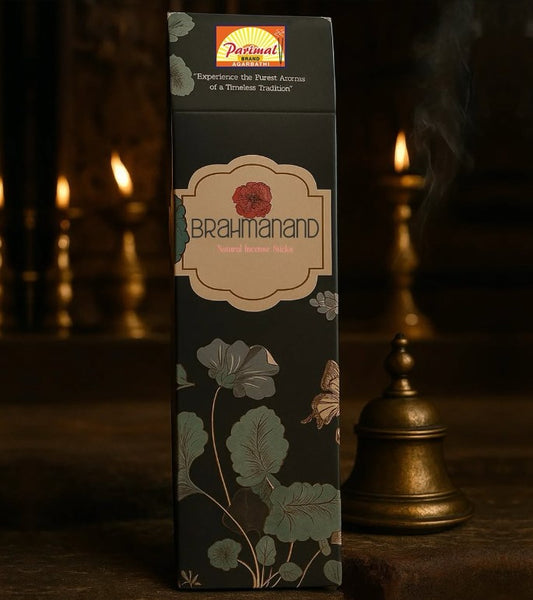 Brahmand incense packaging with floral design and 'Parimal' branding in a dark setting.