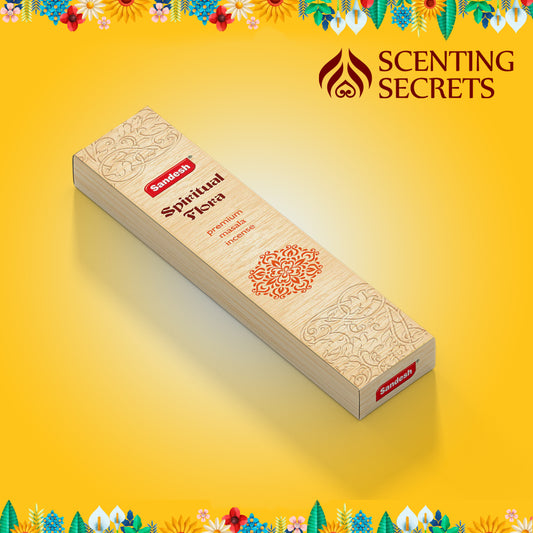 A box of Spiritual Flora premium incense sticks by Sandesh Agarbathi Co., displayed against a yellow background with floral motifs and the brand logo.