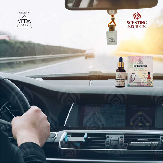 Car interior with Veda & Co and Scenting Secrets car freshener products.